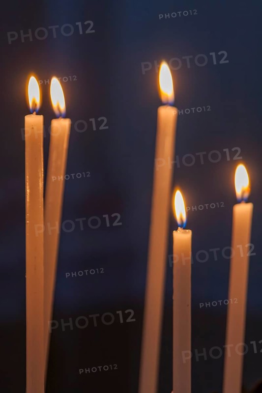 Sacrificial candles in a church, Tuscany, Italy