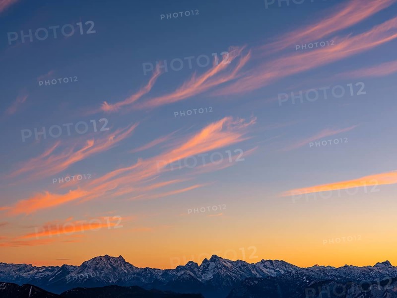 Red-colored plume clouds over the Berchtesgaden Alps at dusk, Hochstaufen, Chiemgau Alps, Upper Bavaria, Bavaria, Germany