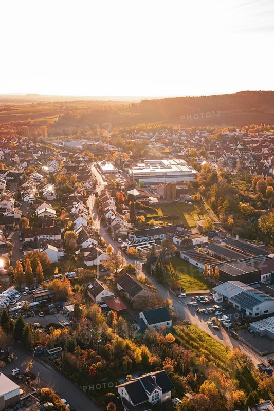 Aerial view of a village at sunset with roads and houses, Großbottwar, Germany