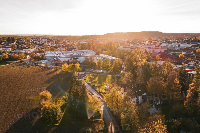 Landscape view at sunset with trees and urban buildings in autumn, Großbottwar, Germany