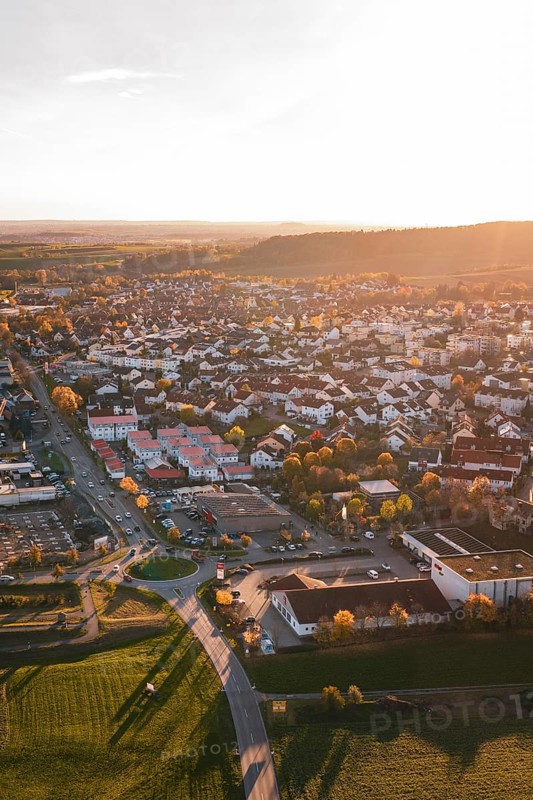 Autumn city view at sunset with roads and numerous buildings, Großbottwar, Germany