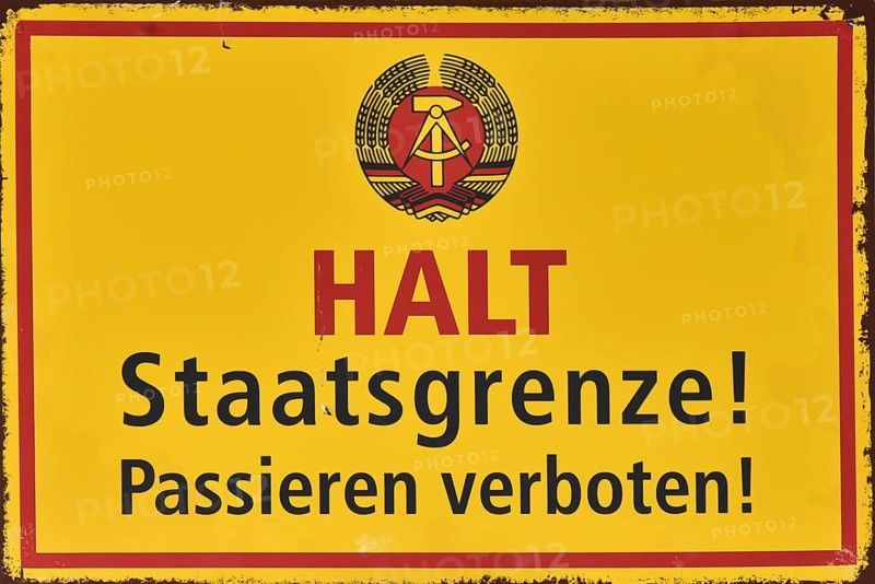 Old sign on the border of West Berlin and East Berlin, during the Cold War, Berlin, Germany