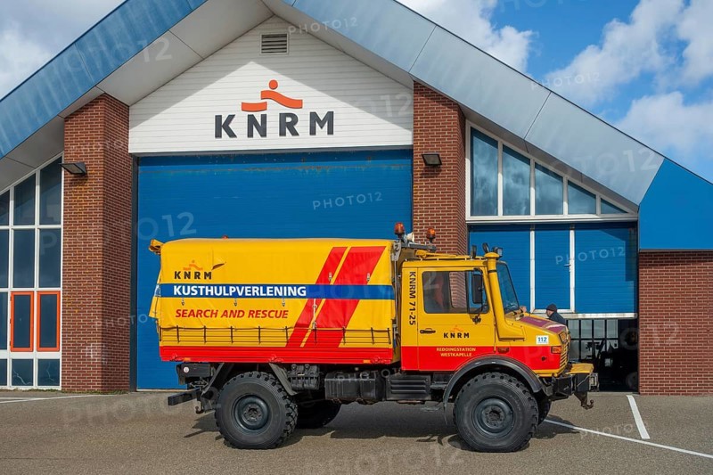 KNRM Mercedes-Benz Unimog 435 truck in front of sea search and rescue lifeboat station at Westkapelle, Zeeland, Netherlands