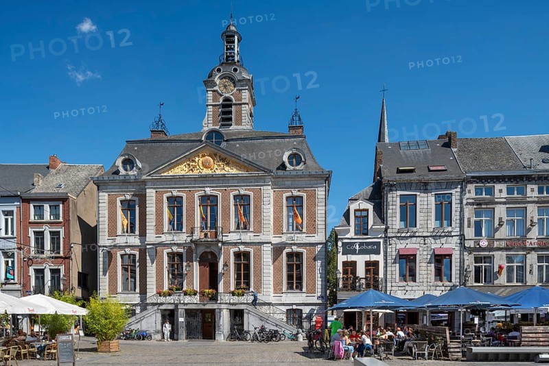 Pavement cafés and 18th century town hall at the Grand Place in the city Huy in summer, province of Liège, Wallonia, Belgium