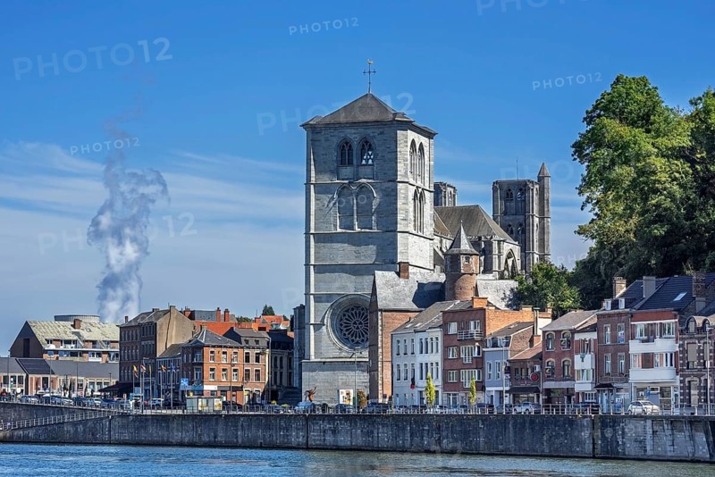 16th century Gothic Notre-Dame collegiate church along the Meuse river in the city Huy, province of Liège, Belgium