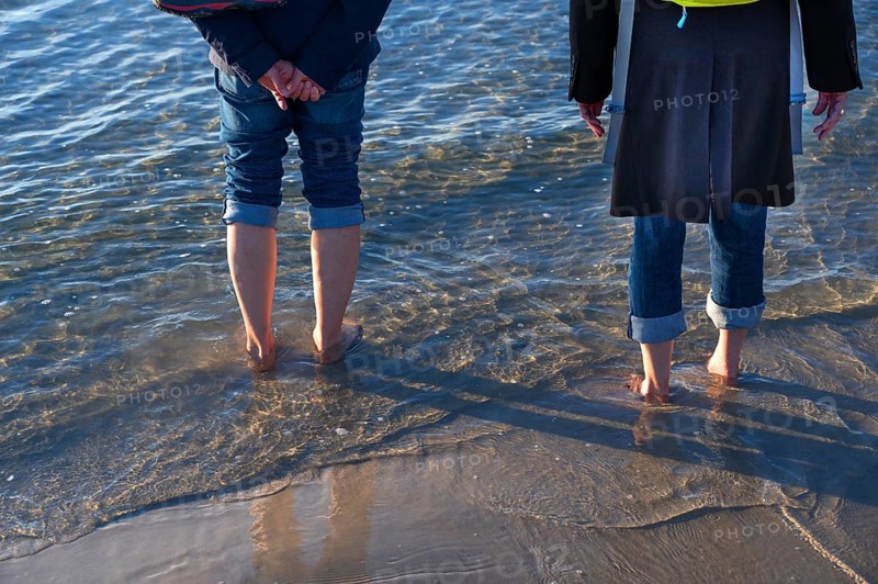 Walkers on Starnd, barefoot in the Baltic Sea, Ahrenshoop, Darß, Mecklenburg-Western Pomerania, Germany
