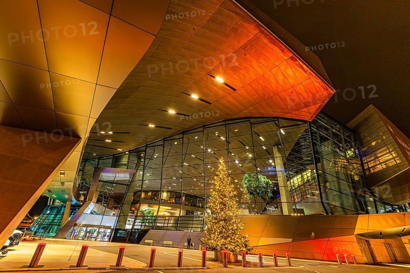 Illuminated Christmas tree in front of the colorful BMW world, Petuelring, Munich, Upper Bavaria, Bavaria, Germany