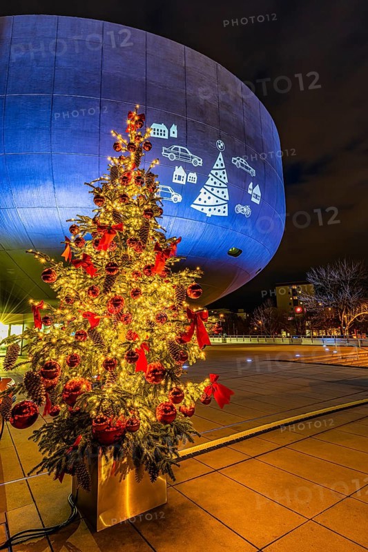 Illuminated Christmas tree with red balls in front of the BMW Museum, BMW World, Petuelring, Munich, Upper Bavaria, Bavaria, Germany