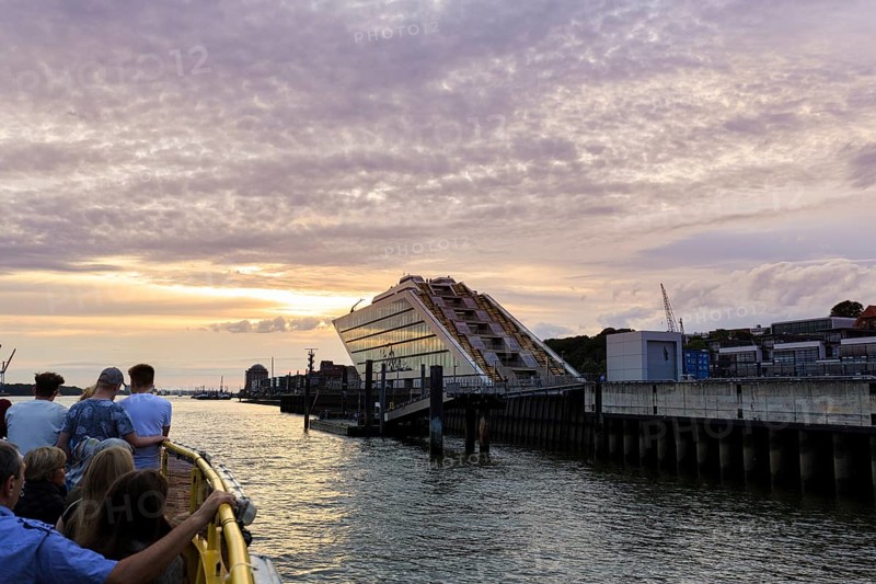 Harbour ferry line 62 with passengers on the Elbe, harbour cruise at sunset, Docklands, Hamburg, Germany