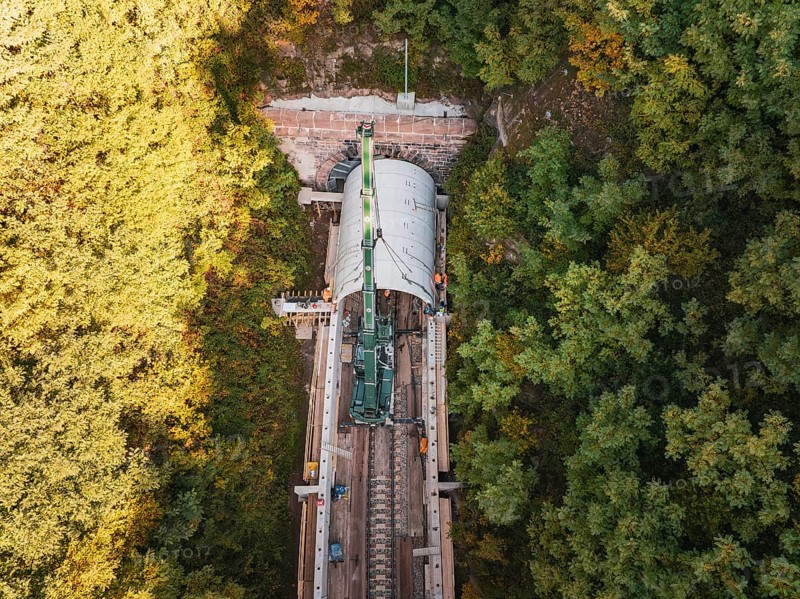 Aerial view of a tunnel boring machine working in a wooded area on a railroad track, built by Hermann, Hesse, Bahn, Calw, Germany