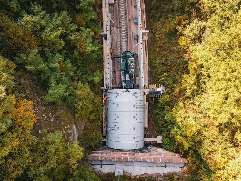 Crane photographed from the air above a tunnel opening in an autumnal landscape, building of Hermann, Hesse, Bahn, Calw, Germany