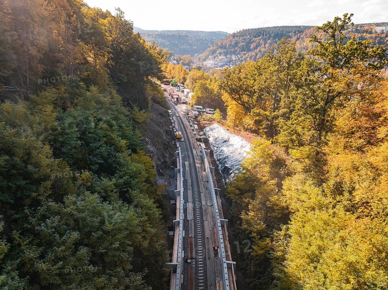 Autumn landscape with construction on railroad tracks and surrounding forest in the sun, Bau der Hermann, Hesse, Bahn, Calw, Germany