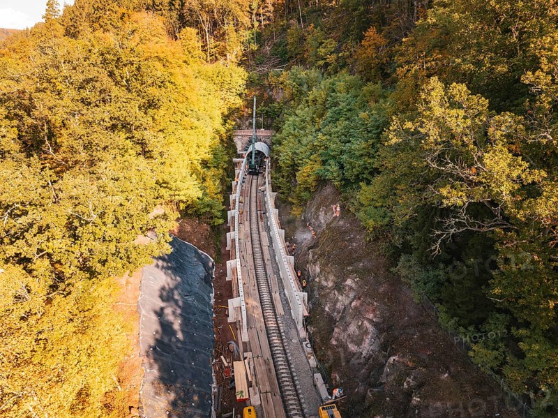 Aerial view of an autumn rail construction site in the forest, Hermann building, Hesse, railway, Calw, Germany