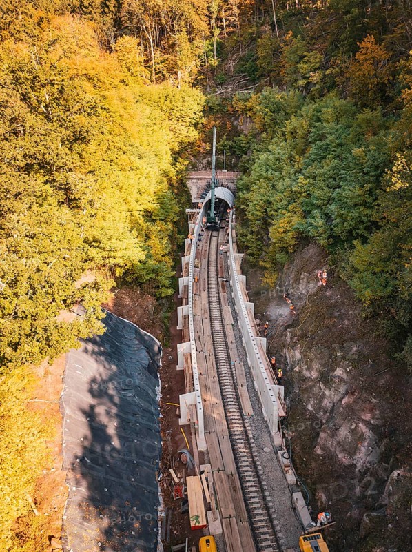 Autumn forest construction site taken from the air with a tunnel boring machine, construction of Hermann, Hesse, Bahn, Calw, Germany
