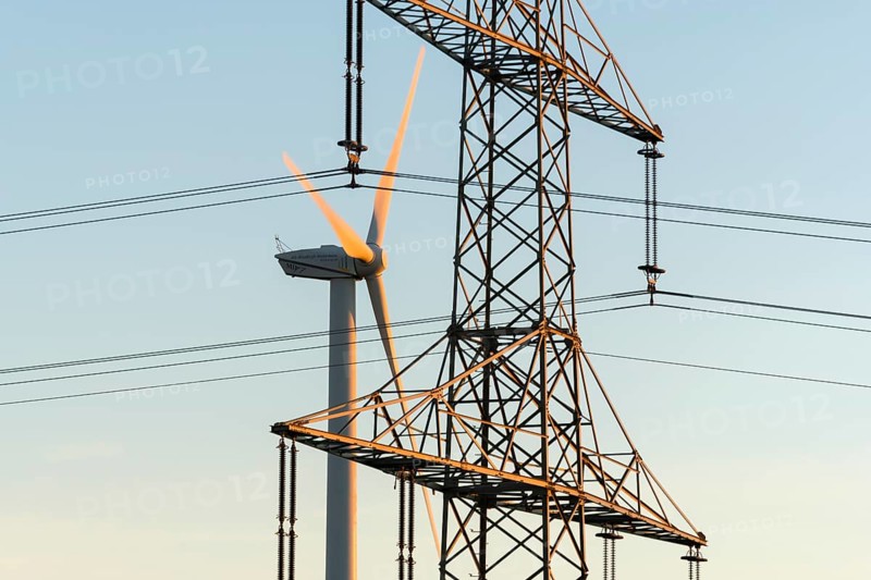 Wind turbine near power line, urban energy infrastructure, Swabian Alps, Baden-Württemberg, Germany
