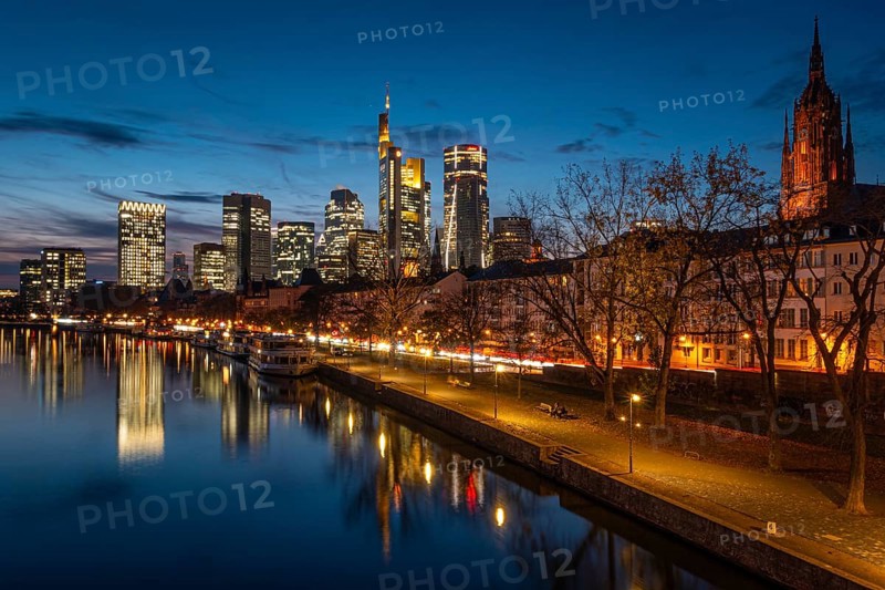 The Frankfurt banking skyline is reflected in the evening in the Main, Frankfurt am Main, Hesse, Germany