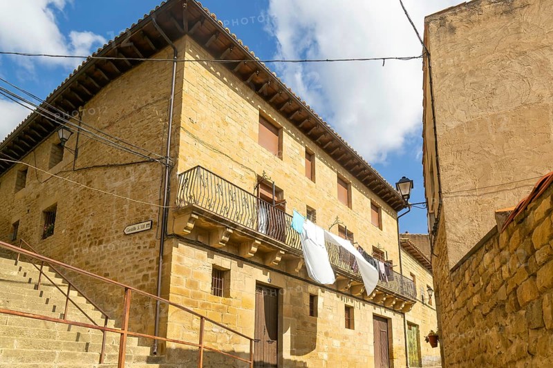 Washing drying on balcony of historic house, medieval village of Uncastillo, Cinco Villas, Zaragoza province, Aragon, Spain