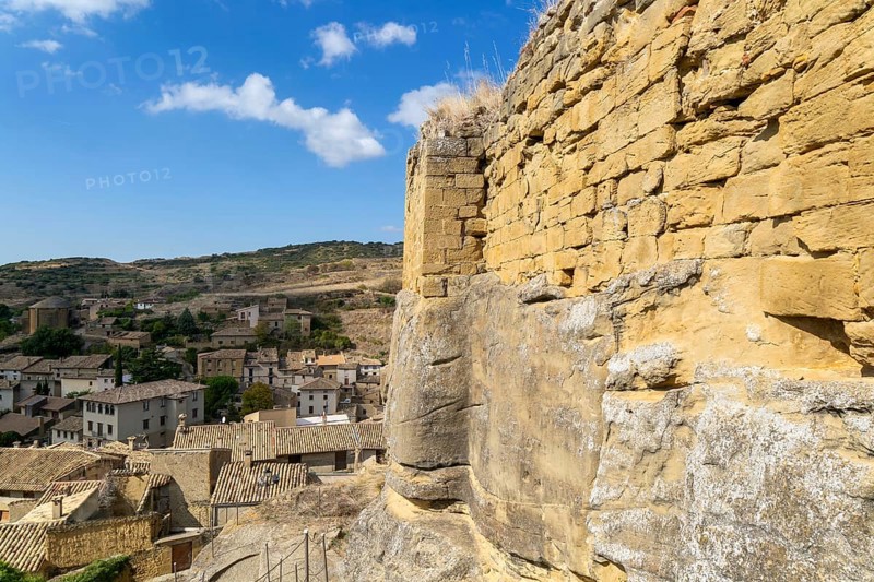 Castle walls built on rock outcrop, medieval village of Uncastillo, Cinco Villas, Zaragoza province, Aragon, Spain