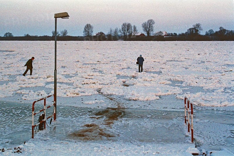 People walk across ice rink, ferry dock, frozen Elbe, Bleckede, Lower Saxony, Germany, January 03, 1997, vintage, retro, old, historic