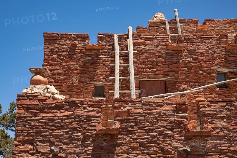Southwestern hopi house 1905 architecture abstract with wooden ladders and clear blue sky