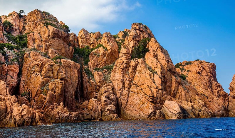 Rock formations and deep blue water in Scandola Nature Reserve, Corsica, Corsica, France