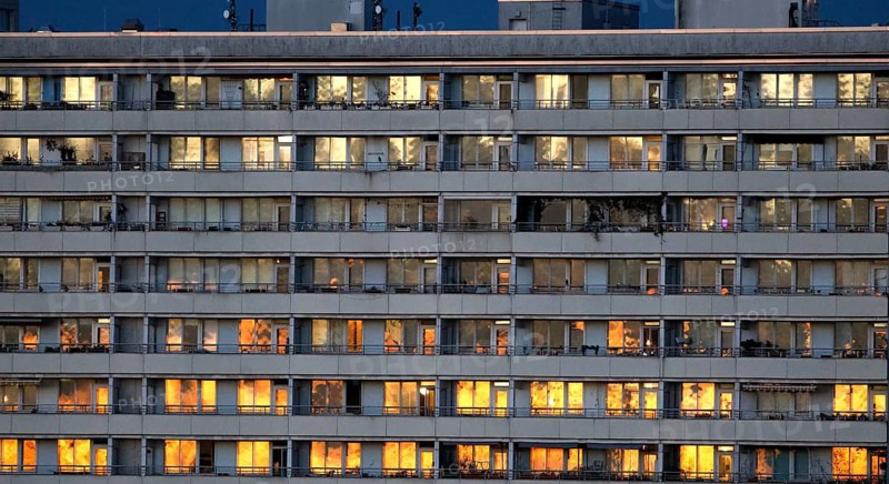Prefabricated high-rise building with illuminated apartments on Alexanderplatz, Berlin, 05.11.2025, Berlin, Berlin, Germany