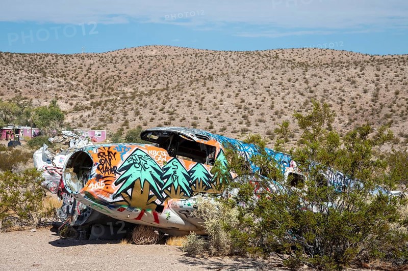 Beatty, Nevada - A decorated twin-engine airplane lies in the desert after a 1977 crash. The aircraft crashed during a promotional stunt for a brothel
