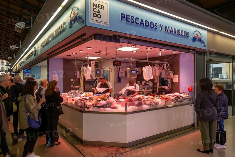Market stall shop store selling fish and seafood inside Mercado Central de Zaragoza, Zaragoza, Aragon, Spain