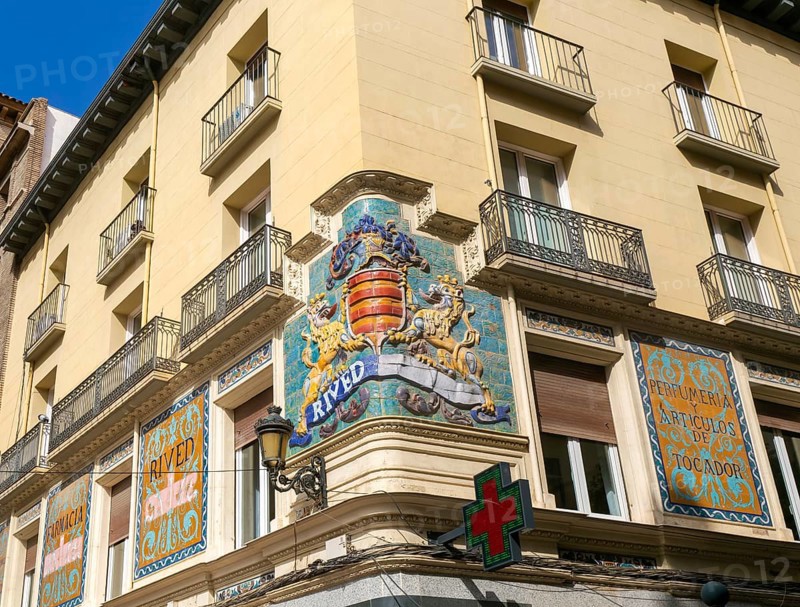 Historic Rived family crest on street corner of above pharmacy shop, Zaragoza, Aragon, Spain