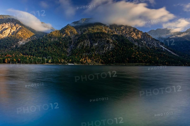 Mountain lake, evening light, mountains, windy, clouds, autumn, autumn color, Plansee, Tyrol, Austria