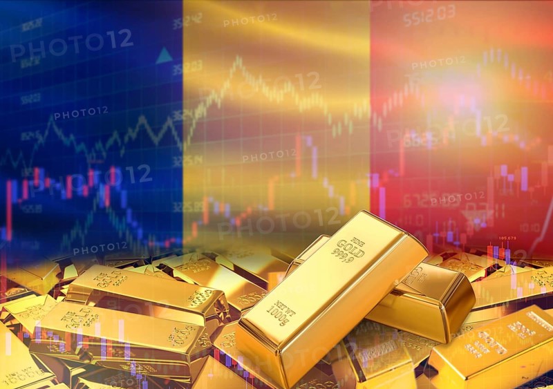 Gold bars on Romania flag in background. Gold bars stacked on Romanian flag. Concept of Romania gold reserves