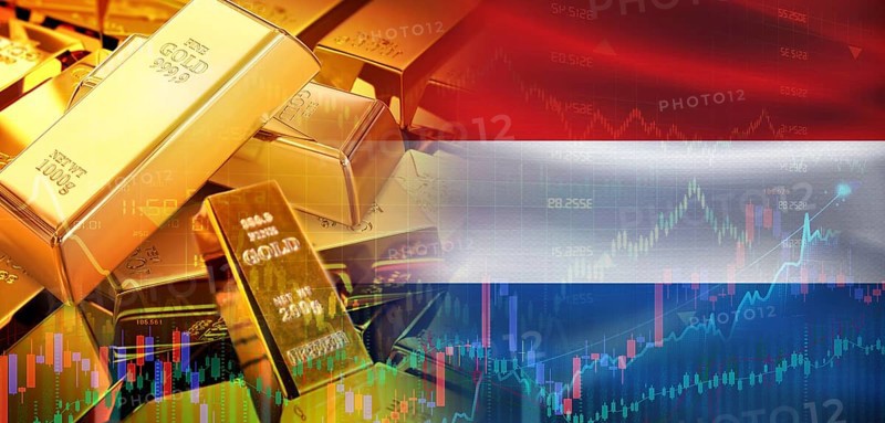 Gold bars stacked on Dutch flag. Netherlands gold reserves, Concept