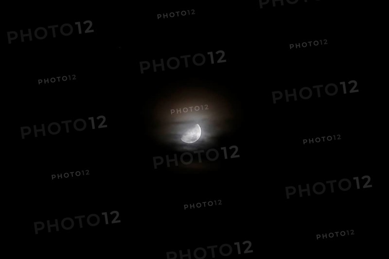 Moon at night behind veil clouds, autumn, Germany