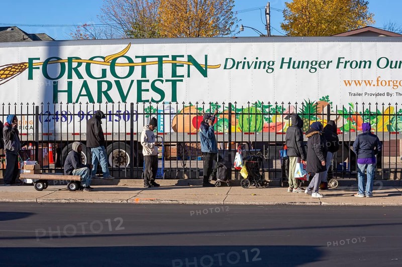 Detroit, Michigan USA - 4 November 2025 - People wait in line to pick up groceries from the anti-hunger nonprofit, Forgotten Harvest. Demand for emergency food at food pantries and soup kitchens has risen dramatically since the federal government shutdown cut SNAP benefits