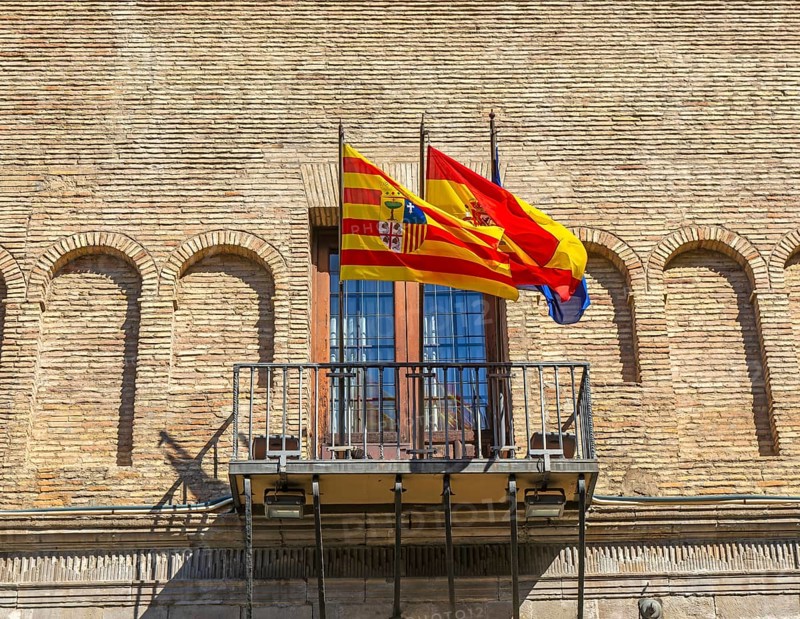 Flags flying on Palacio de los Condes de Morata o de Luna, Zaragoza, Aragon, Spain, Europe now justice department courts