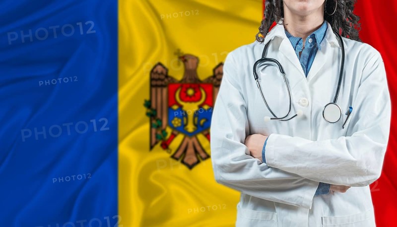 Medical professional on Moldova flag. Healthcare and wellness in Moldova, Concept