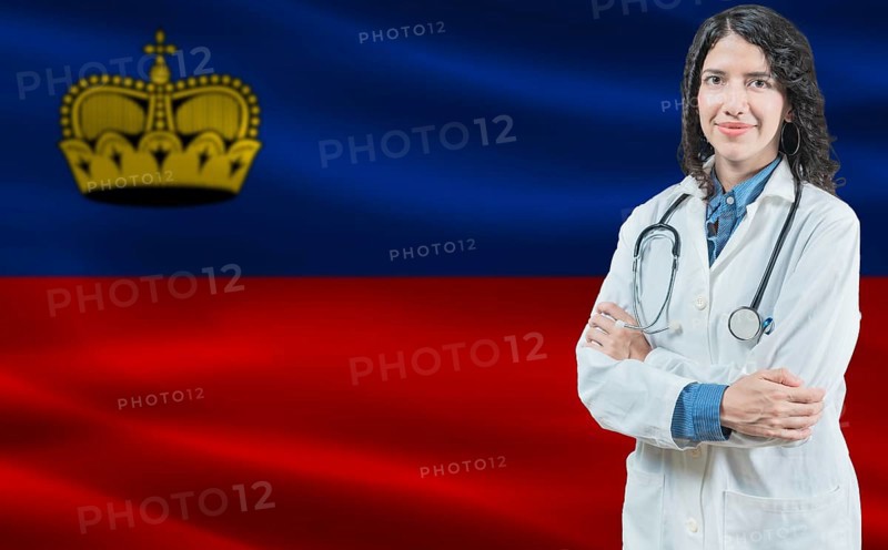 Liechtensteiner medicine and healthcare concept. Doctor close up against Liechtenstein flag background