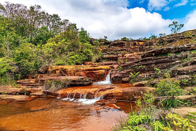 Stream flowing over rocks and forming small waterfalls in the state of Minas Gerais, Brazil, Minas Gerais, Brazil