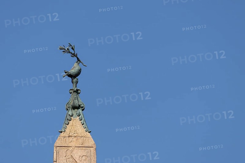 Peace dove bird sculture on the top of a building in the city of Rome, Italy