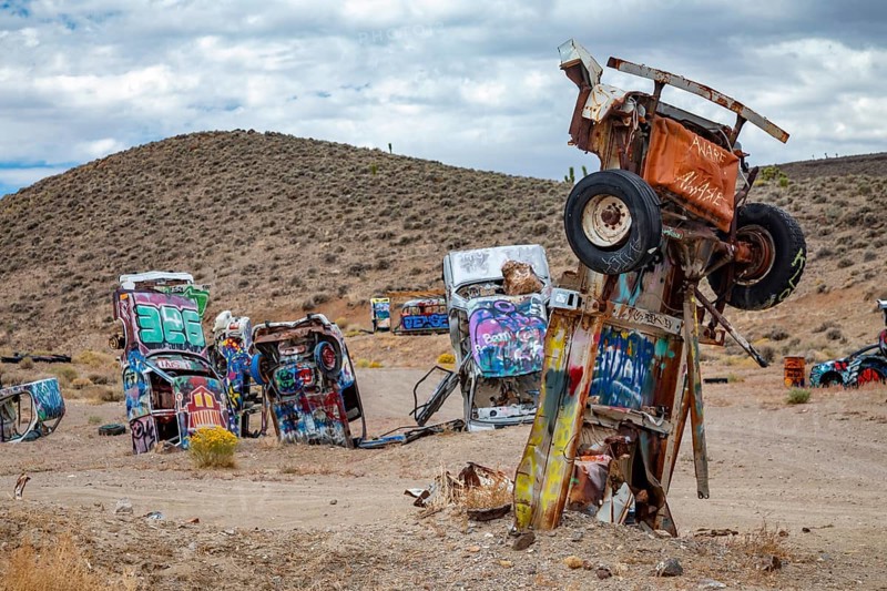 Goldfield, Nevada - The International Car Forest of the Last Church. Artist Mark Rippie has partially buried or decorated several dozen junk cars
