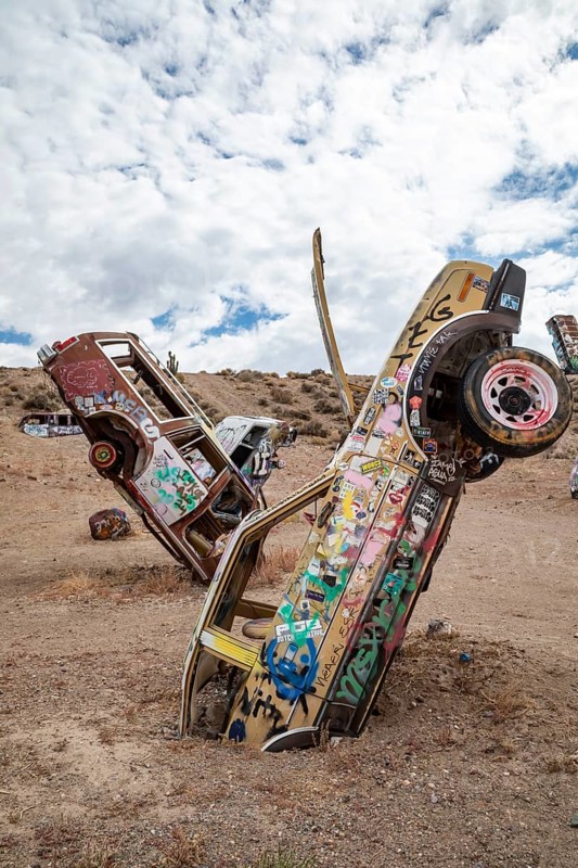 Goldfield, Nevada - The International Car Forest of the Last Church. Artist Mark Rippie has partially buried or decorated several dozen junk cars