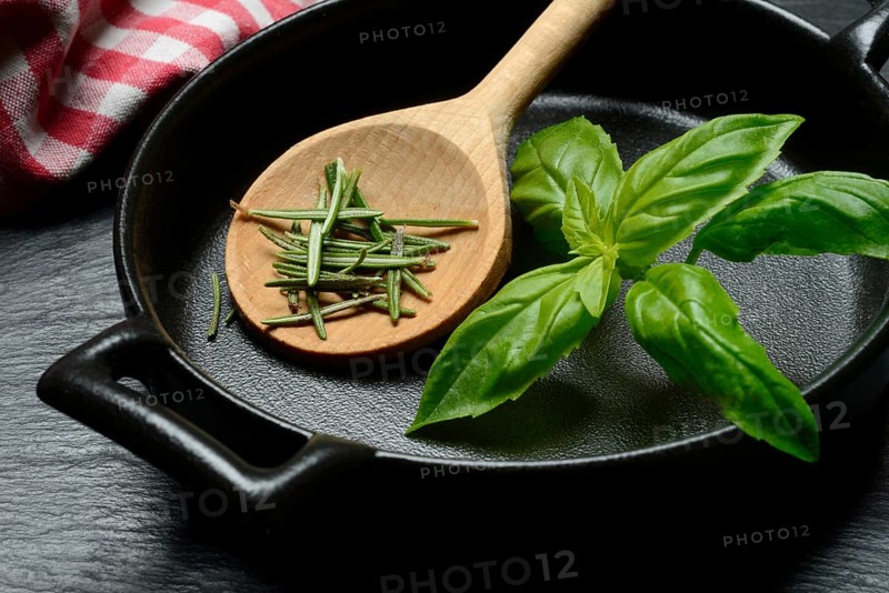 Rosemary, rosemary leaves and basil leaf with cooking pot