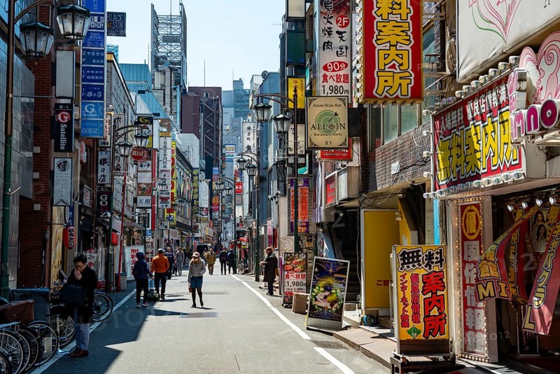 Lots of colorful signs of shops, restaurants and bars in a street, Shinjuku City, Tokyo, Japan