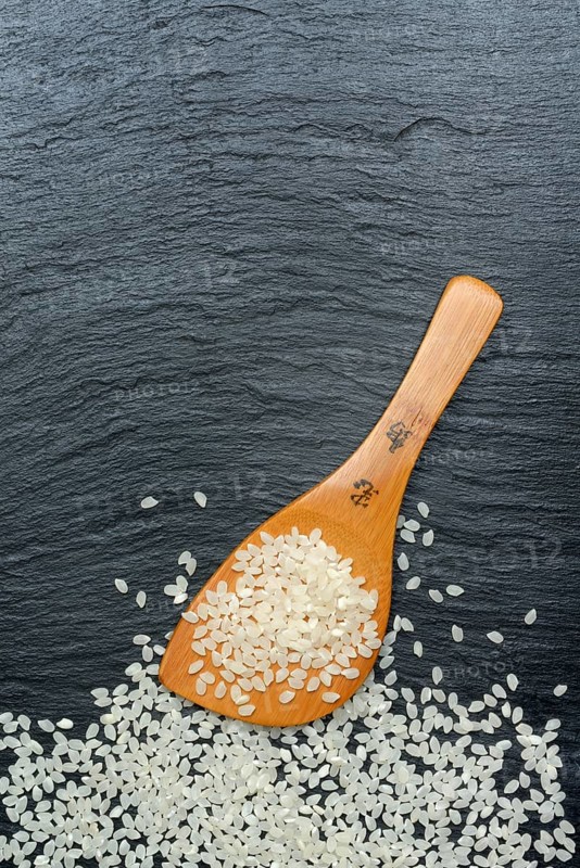 Rice grains with cooking spoon, rice