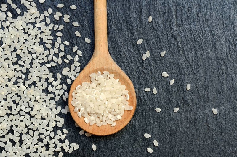 Rice grains in cooking spoons, rice