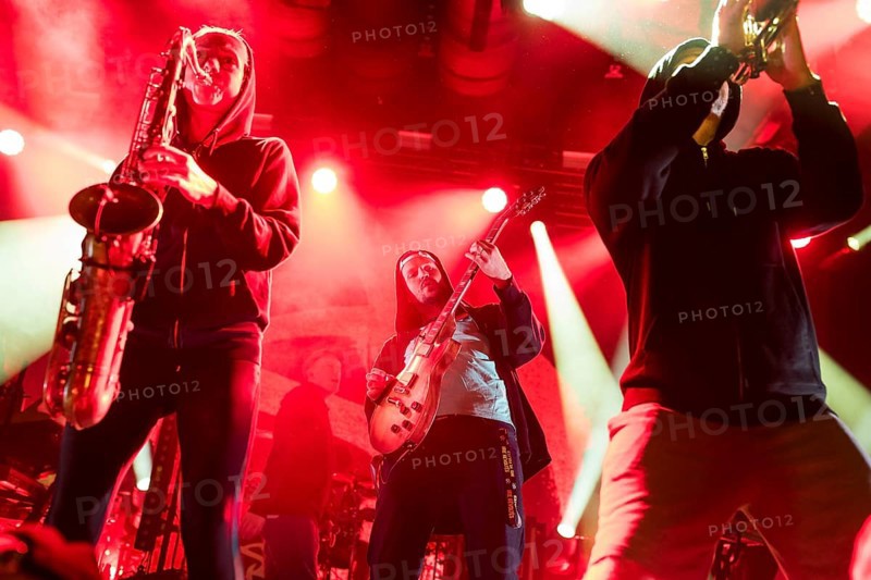 Gesa (saxophonist), iDot (Tobias von Kitzing, guitarist) and Poldi (trumpeter) from Irie Révoltés live on Irieunion - Le Re-Tour pour une année! Tour in Berlin's Columbiahalle on 31.10.2025
