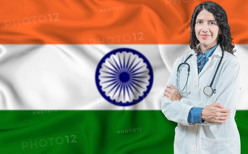Indian medicine and healthcare concept. Doctor close up against India flag background