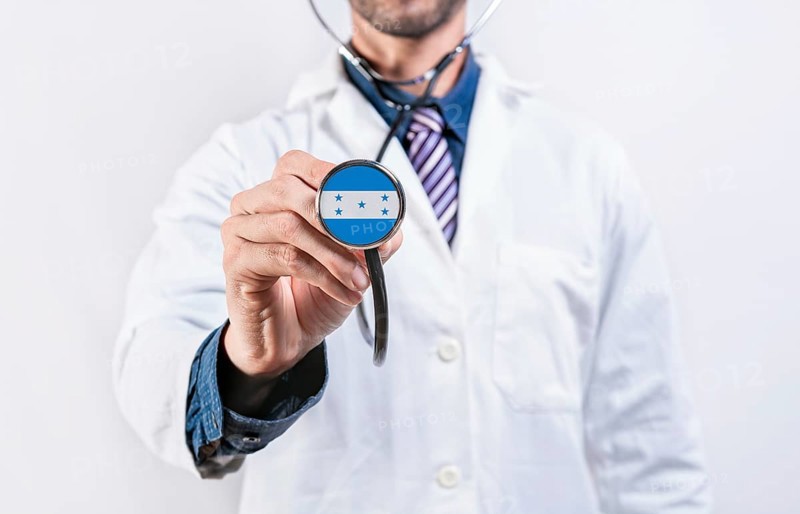 Honduras healthcare system, doctor holding stethoscope. Honduras health and medical insurance concept