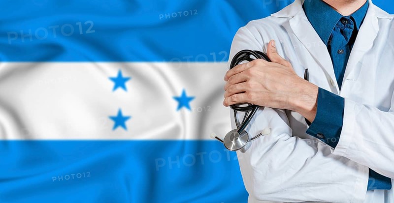Honduran healthcare concept. Doctor with stethoscope on Honduras flag. Doctor holding stethoscope on Honduran flag