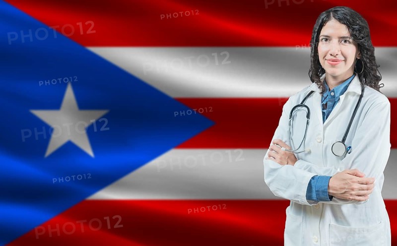 Puerto Rican medicine and healthcare concept. Close up of doctor against Puerto Rico flag background